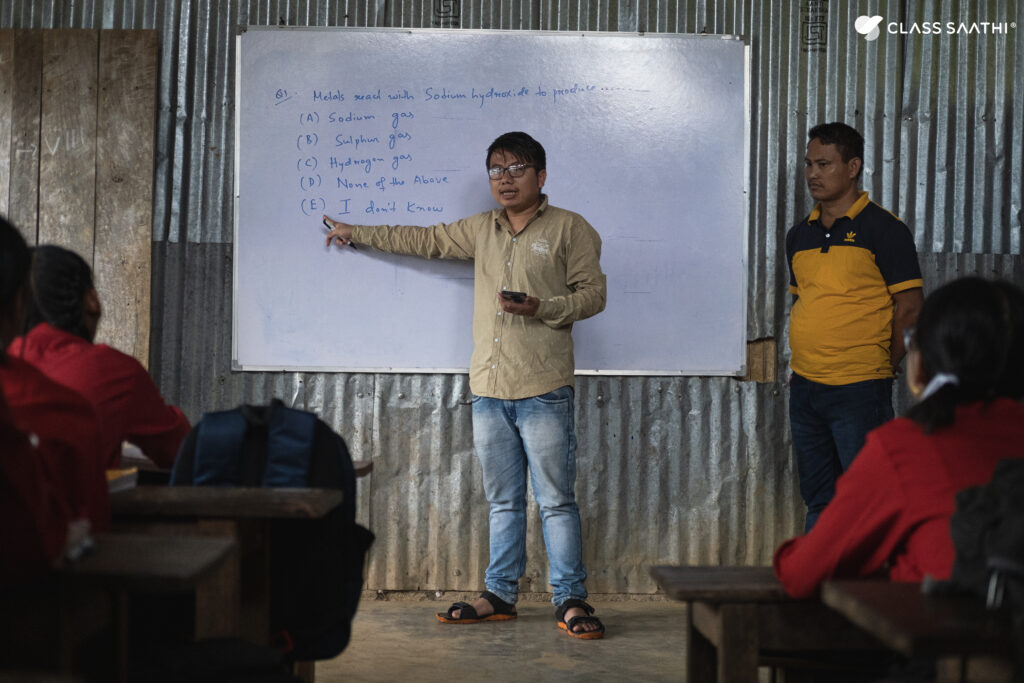 Teacher using Class Saathi mobile app in Sunbird Trust funded school in Ijeirong, Manipur