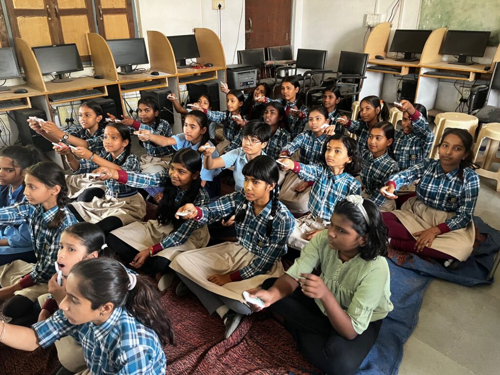 Students actively participating using clickers in a classroom quiz session.