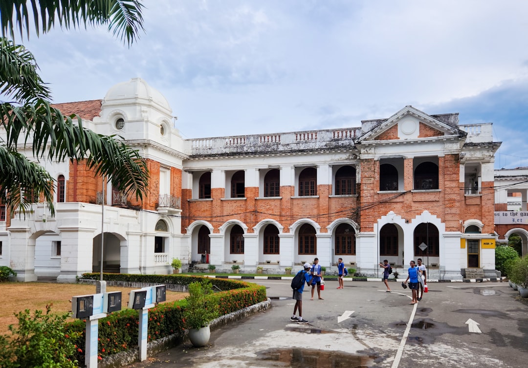 This is the main building of Royal College, Colombo. It was established in 1835 as the Colombo Academy. As Sri Lanka's oldest public school, it boasts a rich history intertwined with the country's colonial past and its evolution as an independent nation. The distinctive architecture, with its red brick facade, white trim, and arched windows, reflects the British colonial influence prevalent in the 19th century. Today, Royal College remains a prestigious institution, renowned for its academic excellence and contribution to Sri Lankan society.